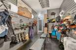 This stylish mudroom offers a practical and organized space for storing outdoor gear.