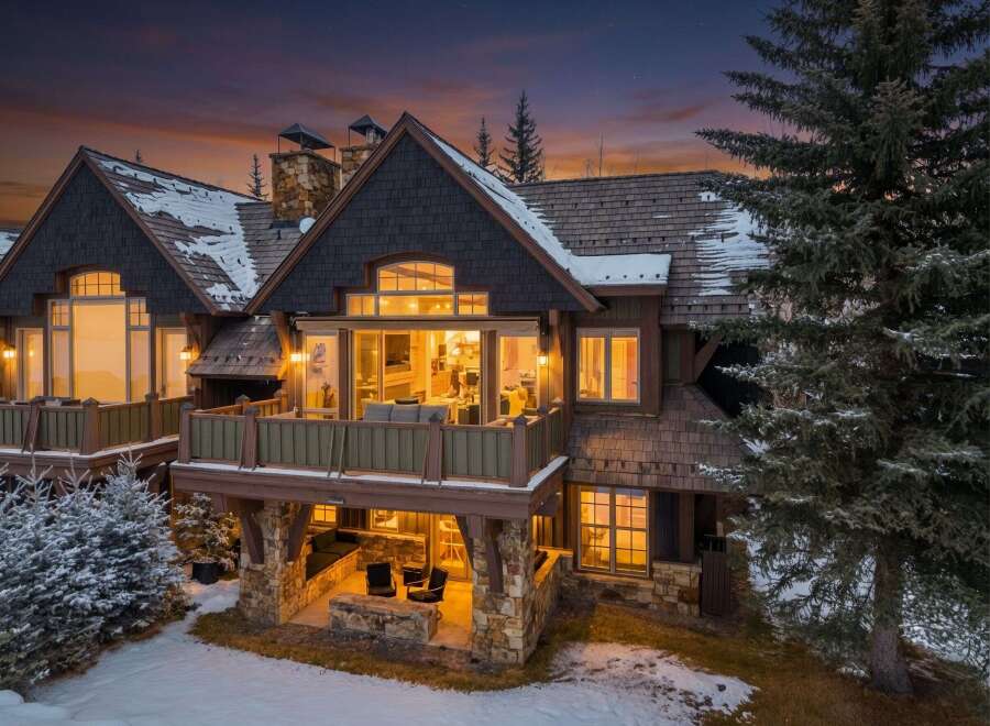 This stunning mountain home offers a luxurious retreat with its beautiful architecture and inviting outdoor spaces.
