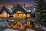 This stunning mountain home offers a luxurious retreat with its beautiful architecture and inviting outdoor spaces.