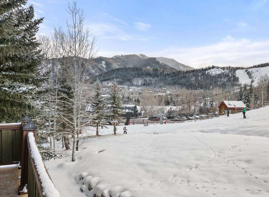 Enjoy breathtaking mountain views from this stunning property! This home offers easy access to the ski slopes, perfect for winter enthusiasts.