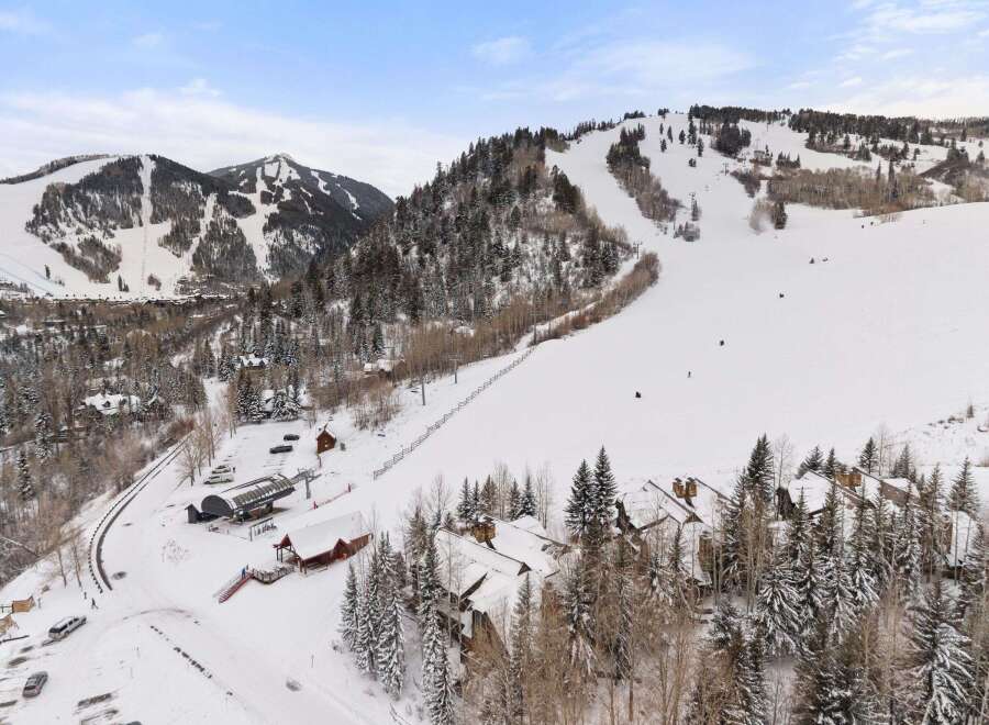 Nestled in a picturesque winter wonderland, this stunning property offers unparalleled access to world-class skiing and snowboarding.