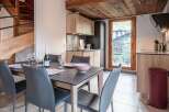 Experience luxury living in this stunning property featuring a modern kitchen and a stylish dining area.