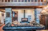 Step into rustic elegance with this stunning property, featuring exposed wooden beams and stone accents that exude warmth and charm.
