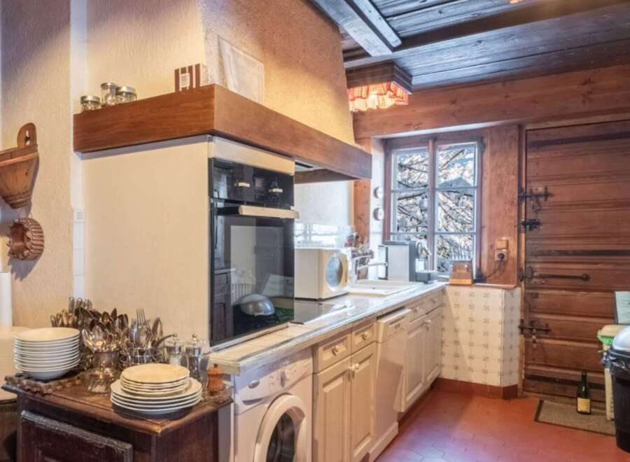 Step into the heart of this charming kitchen, where rustic elegance meets modern convenience.
