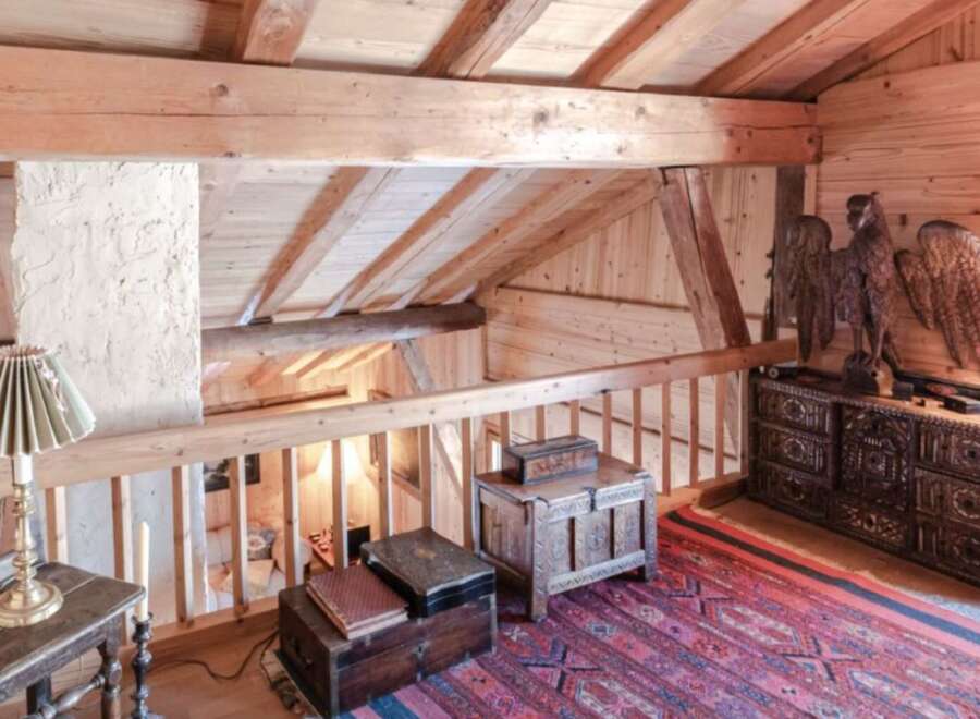 Step into rustic elegance with this stunning property, showcasing a beautifully crafted wooden interior.