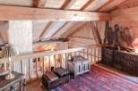 Step into rustic elegance with this stunning property, showcasing a beautifully crafted wooden interior.