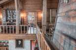 Step into rustic elegance with this stunning property, showcasing exquisite wooden architecture.