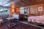 Step into a cozy and inviting bedroom with rustic charm.