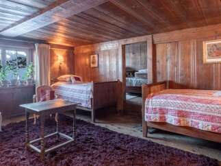 Step into a cozy and inviting bedroom with rustic charm.