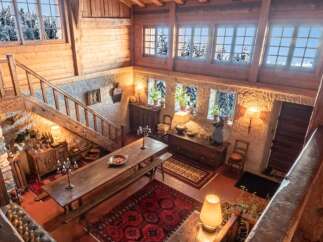 Step into a world of rustic charm with this stunning property, featuring a beautifully designed interior with exposed wooden beams and a cozy ambiance.
