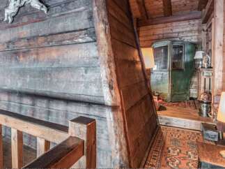 Step into rustic elegance with this stunning property, showcasing exquisite wooden craftsmanship throughout.
