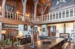 Step into rustic elegance with this stunning property, showcasing a harmonious blend of wood and stone.