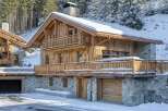 Experience the epitome of alpine luxury in this stunning wooden chalet.