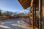 Experience the ultimate in luxury living with this stunning property featuring a spacious deck with breathtaking mountain views.