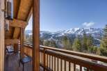 Enjoy breathtaking mountain views from this stunning chalet balcony.
