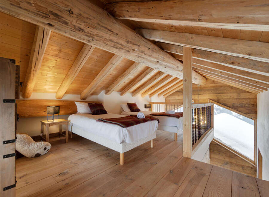 Experience rustic charm in this stunning loft bedroom.