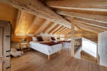 Experience rustic charm in this stunning loft bedroom.
