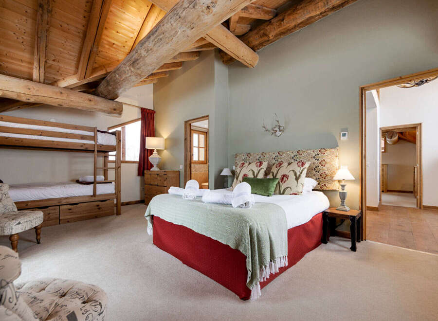 This stunning bedroom features a unique blend of rustic charm and modern comfort.
