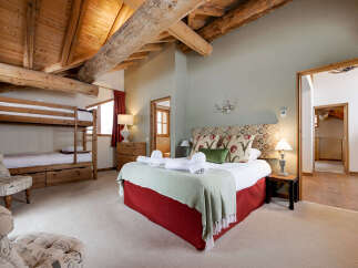 This stunning bedroom features a unique blend of rustic charm and modern comfort.
