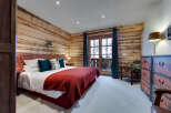 Experience rustic charm in this cozy bedroom.
