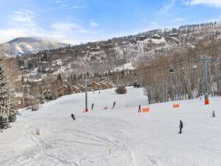 Enjoy the ultimate winter escape with this stunning ski-in/ski-out property! Nestled in a picturesque mountain setting, this home offers unparalleled access to the slopes.