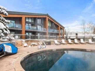 Enjoy a luxurious stay at this stunning property featuring a heated outdoor pool, perfect for relaxing in any season.