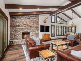 Experience luxury living in this stunning property featuring a cozy fireplace, perfect for chilly evenings.