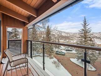 Enjoy breathtaking mountain views from this stunning balcony.