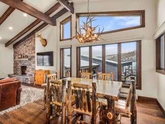 This stunning property boasts a rustic yet elegant dining area, perfect for entertaining guests.