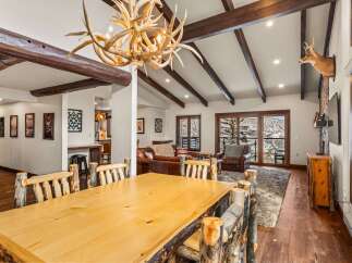 This stunning property boasts a rustic, yet elegant design, perfect for those seeking a mountain retreat.
