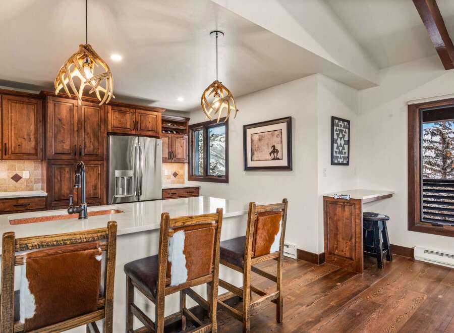 This stunning kitchen boasts custom cabinetry, stainless steel appliances, and a spacious island perfect for entertaining.