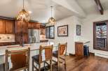This stunning kitchen boasts custom cabinetry, stainless steel appliances, and a spacious island perfect for entertaining.