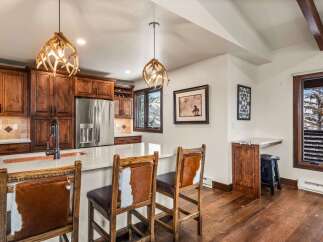 This stunning kitchen boasts custom cabinetry, stainless steel appliances, and a spacious island perfect for entertaining.