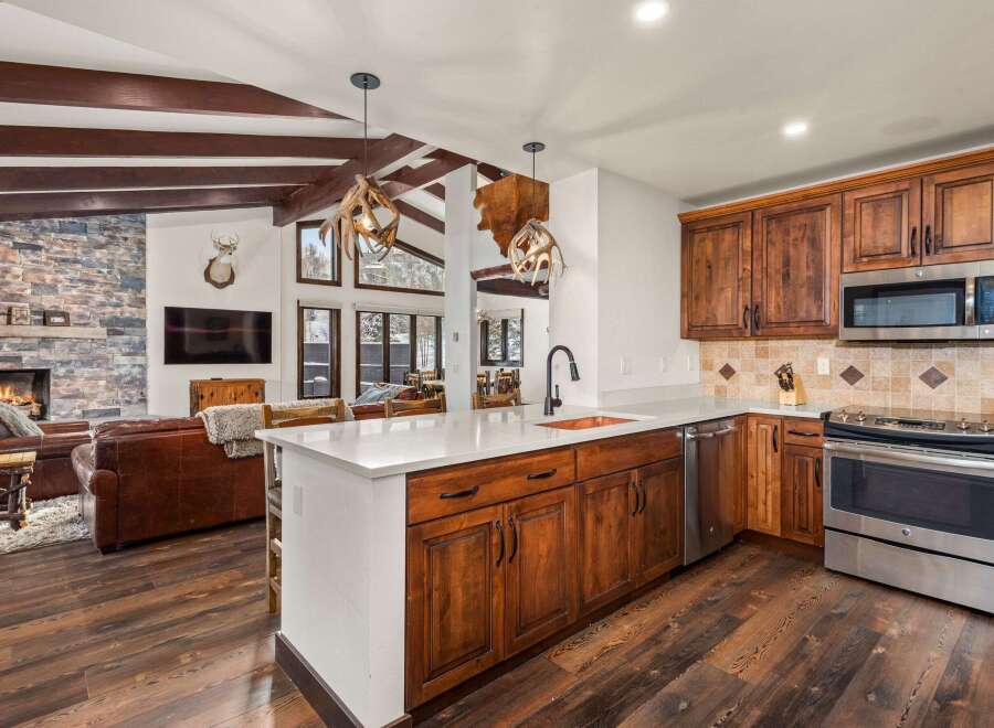 This stunning kitchen boasts rustic charm with its wooden cabinetry and island.