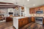 This stunning kitchen boasts rustic charm with its wooden cabinetry and island.
