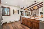 This stunning kitchen boasts a rustic yet modern design, perfect for entertaining.