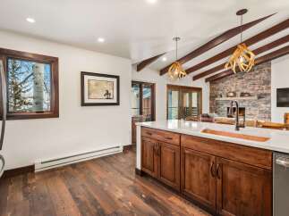 This stunning kitchen boasts a rustic yet modern design, perfect for entertaining.