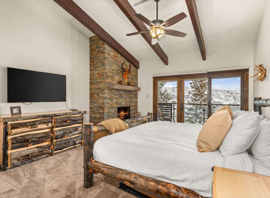 Experience the ultimate mountain retreat in this stunning bedroom.