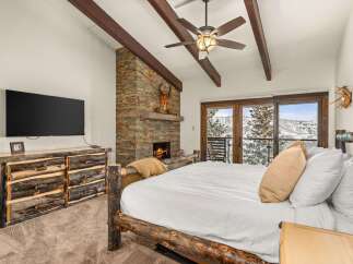 Experience the ultimate mountain retreat in this stunning bedroom.