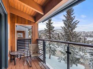 Enjoy breathtaking mountain views from this stunning balcony.