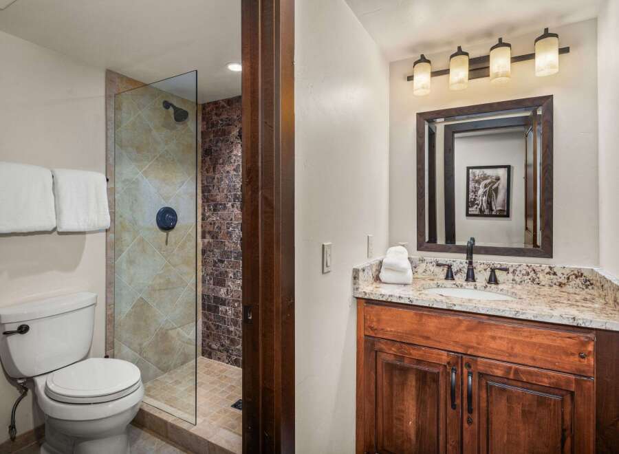Step into luxury with this beautifully designed bathroom! Featuring a sleek glass shower, elegant vanity, and stylish lighting, this space offers both functionality and sophistication.