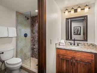 Step into luxury with this beautifully designed bathroom! Featuring a sleek glass shower, elegant vanity, and stylish lighting, this space offers both functionality and sophistication.