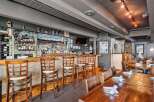 Step into a cozy and inviting restaurant space, perfect for your next dining experience.
