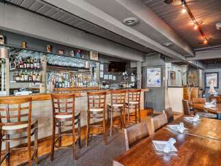 Step into a cozy and inviting restaurant space, perfect for your next dining experience.