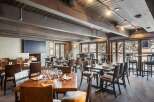 Step into a cozy and inviting restaurant with a rustic charm.