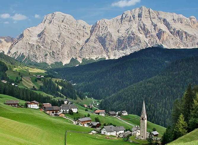 Nestled in a picturesque valley, this charming property offers stunning views of the majestic mountains.