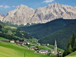 Nestled in a picturesque valley, this charming property offers stunning views of the majestic mountains.