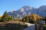 Explore the breathtaking beauty of this mountain property, surrounded by vibrant autumn foliage and towering peaks.