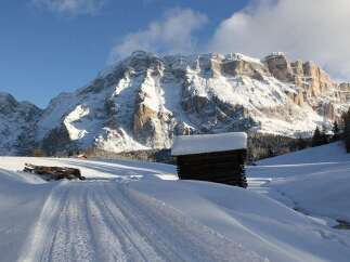 Experience the serenity of mountain living in this stunning winter landscape.