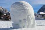 This unique snow sculpture, resembling a hand, is a testament to the creativity found in winter wonderlands.